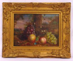 A framed oil on canvas still life with fruit and a birds nest with eggs under a tree, 29 x 40cm