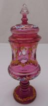 A Bohemian pink glass vase and cover of waisted cylindrical form on raised circular base, 36cm (h)