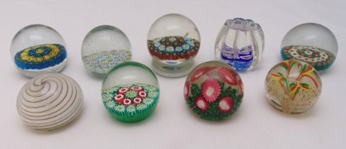 Nine glass paperweights to include Millefiori of various form and size