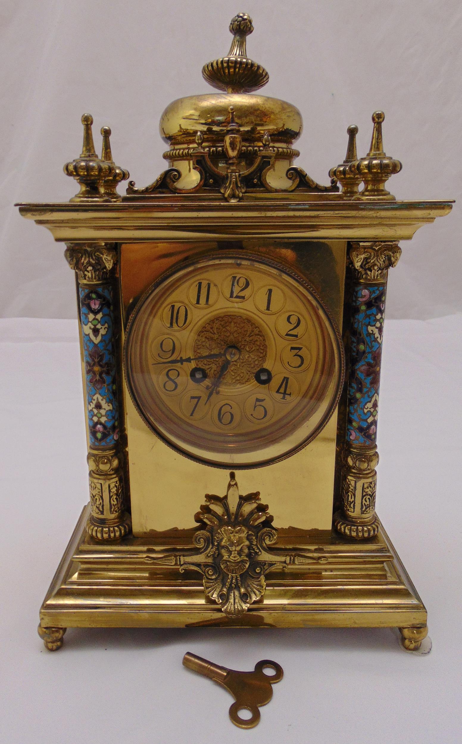 A French rectangular gilt metal mantle clock with gilded dial Arabic numerals and champlevé