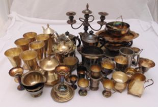 A quantity of silver plate to include a candelabrum, teasets, trays, goblets, fruit dishes, ice