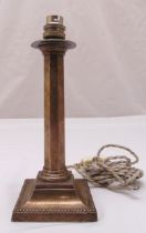 A Victorian hallmarked silver table candlestick of facet columnular form on raised square base