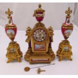 A late 19th century French clock set, the circular dial with Roman numerals and vase form finial,