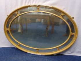 A mid 20th century oval wall mirror with gilded plaster border, 124 x 87 x 5cm, A/F