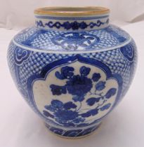 A Chinese Qing dynasty blue and white baluster vase decorated with stylised flowers and leaves, 24cm