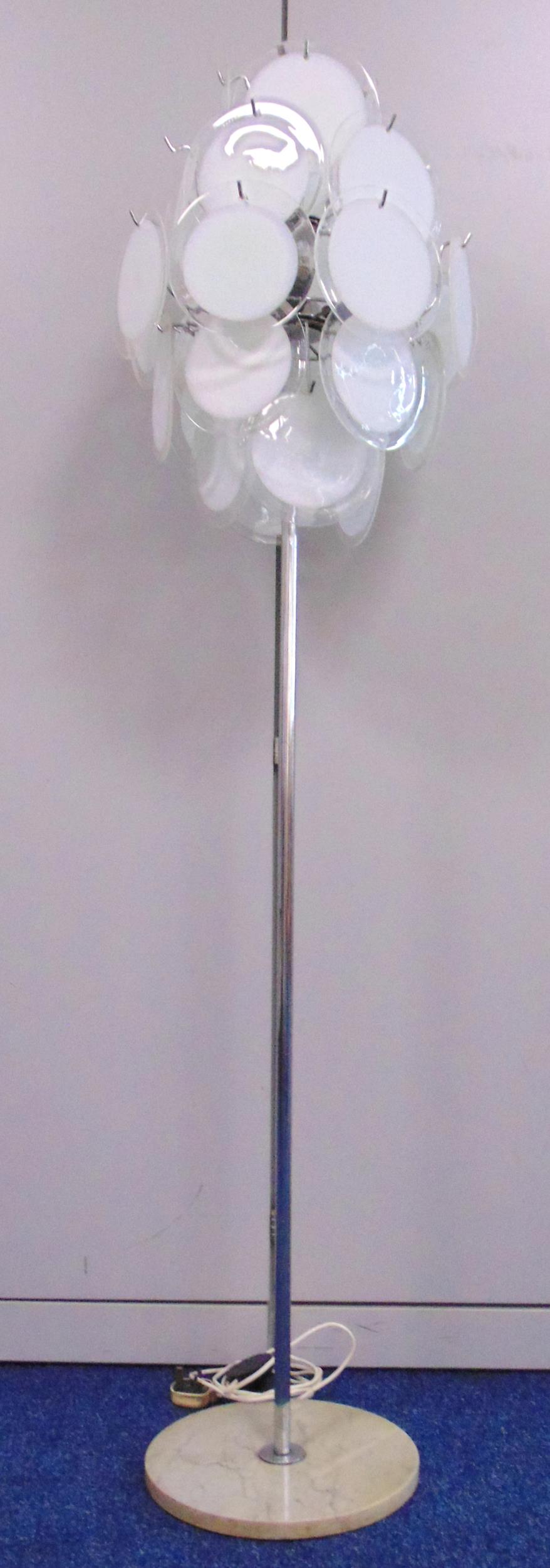 A mid 20th century chrome and glass standard lamp with detachable glass discs, the cylindrical stand