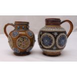 Two 19th century Doulton Lambeth stoneware jugs of ovoid form, with applied floret and roundel
