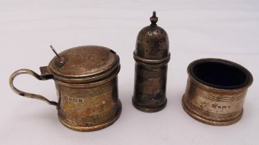 A hallmarked silver three piece condiment set of banded cylindrical form, approx total weight of