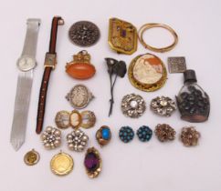 A quantity of costume jewellery to include earrings, brooches, bangles and wristwatches