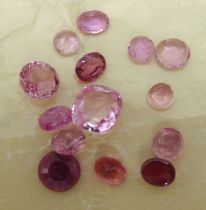 A quantity of polished precious and semi precious stones to include rubies, morganites and rose