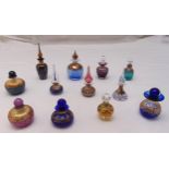 Twelve hand blown coloured glass dressing table perfume bottles of various form, size and colour
