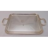 A continental white metal rectangular tea tray with moulded borders and pierced scroll handles,