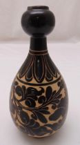 A Chinese Cizhou ware baluster form vase decorated with stylised flowers and leaves, 25cm (h)