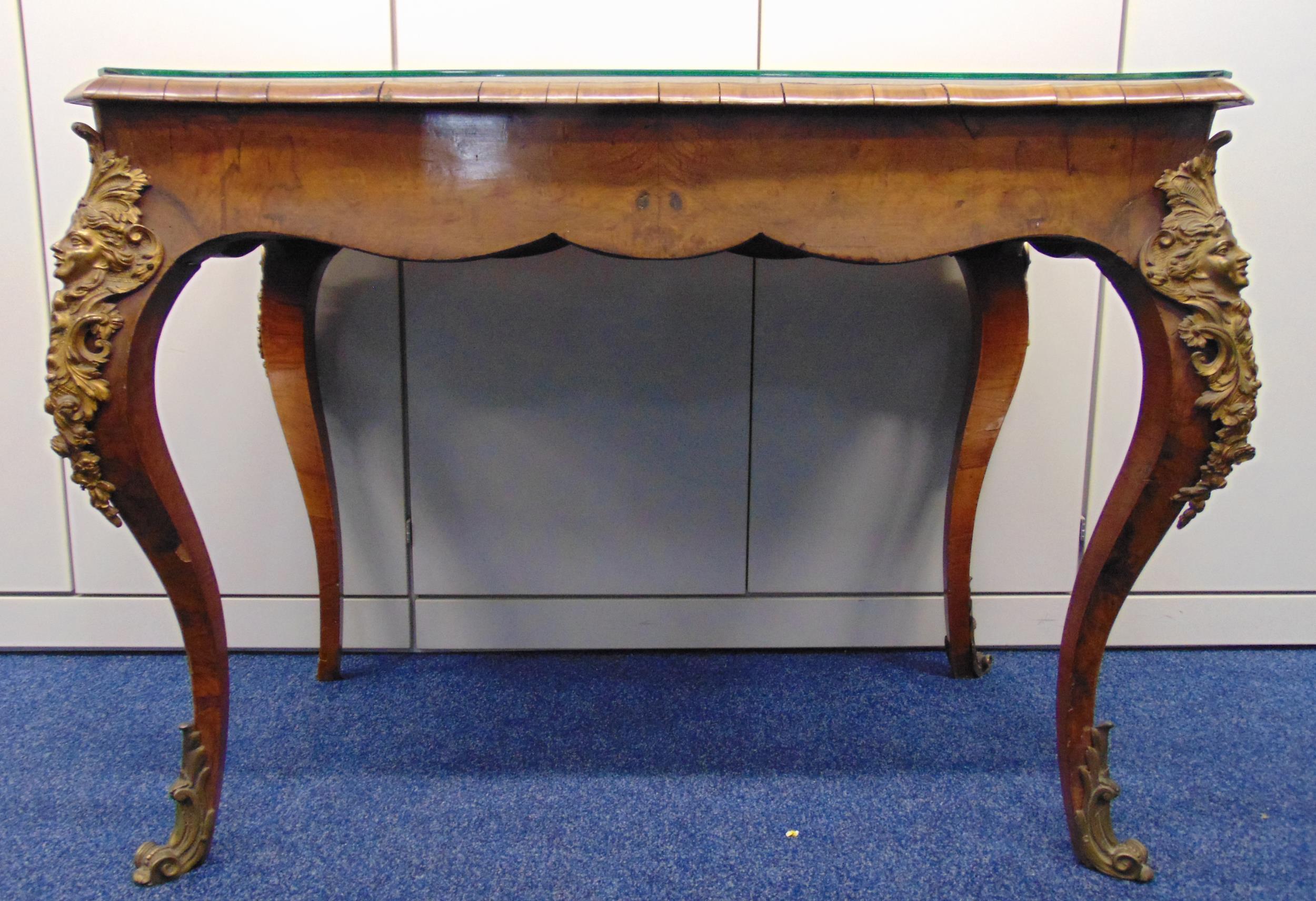 A French 19th century rectangular mahogany hall table with inset fabric and glass top on cabriole