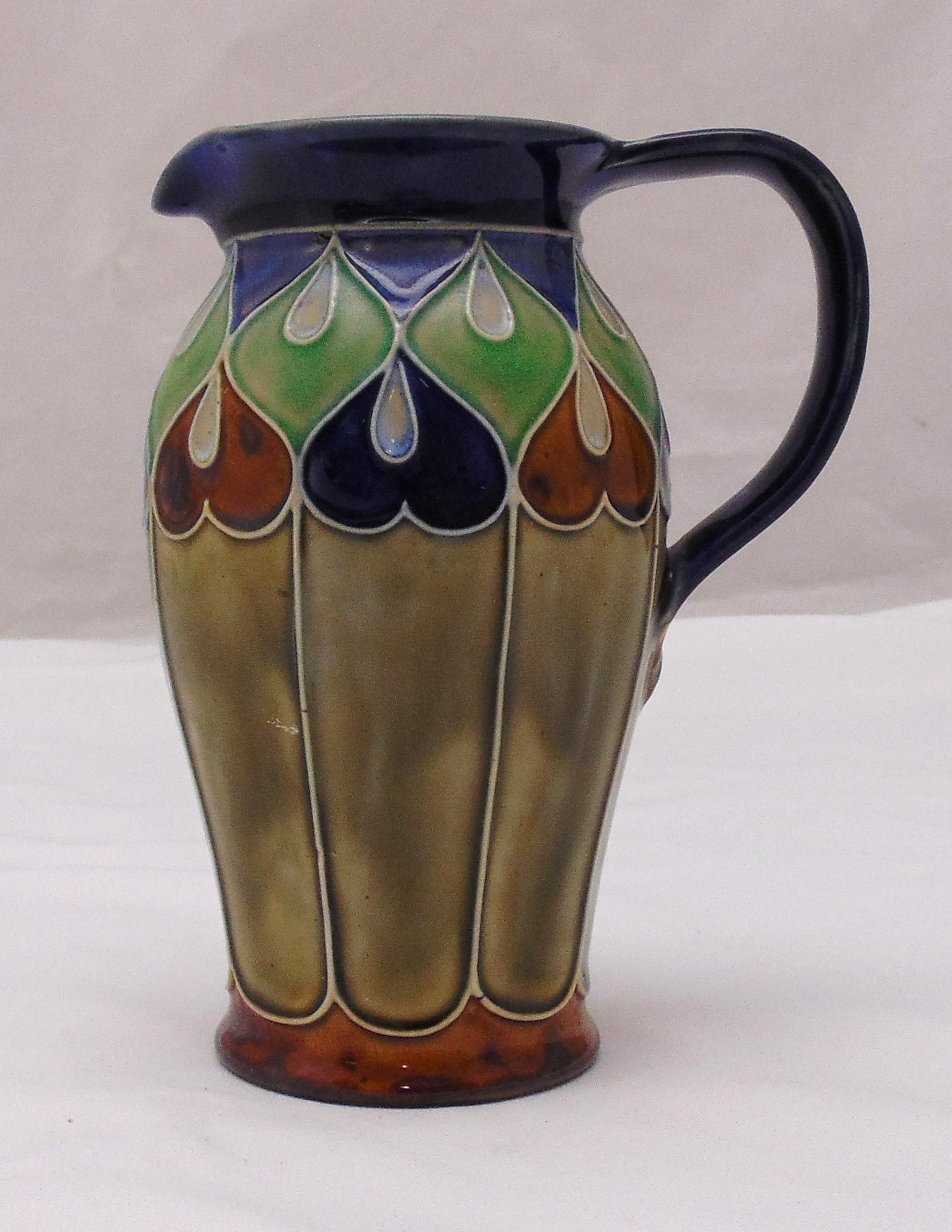 A Royal Doulton Art Nouveau jug, tube-line heart decoration, impressed makers monogram and marks