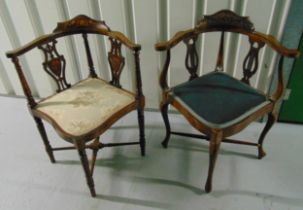 Two mahogany upholstered corner chairs on four cabriole legs
