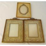 Three continental decorative gilded metal photograph frames, 24 x 19cm and 22 x 17cm