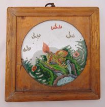 A Chinese famile verte Kylin porcelain plaque mounted in a square wooden frame, 24 x 24cm