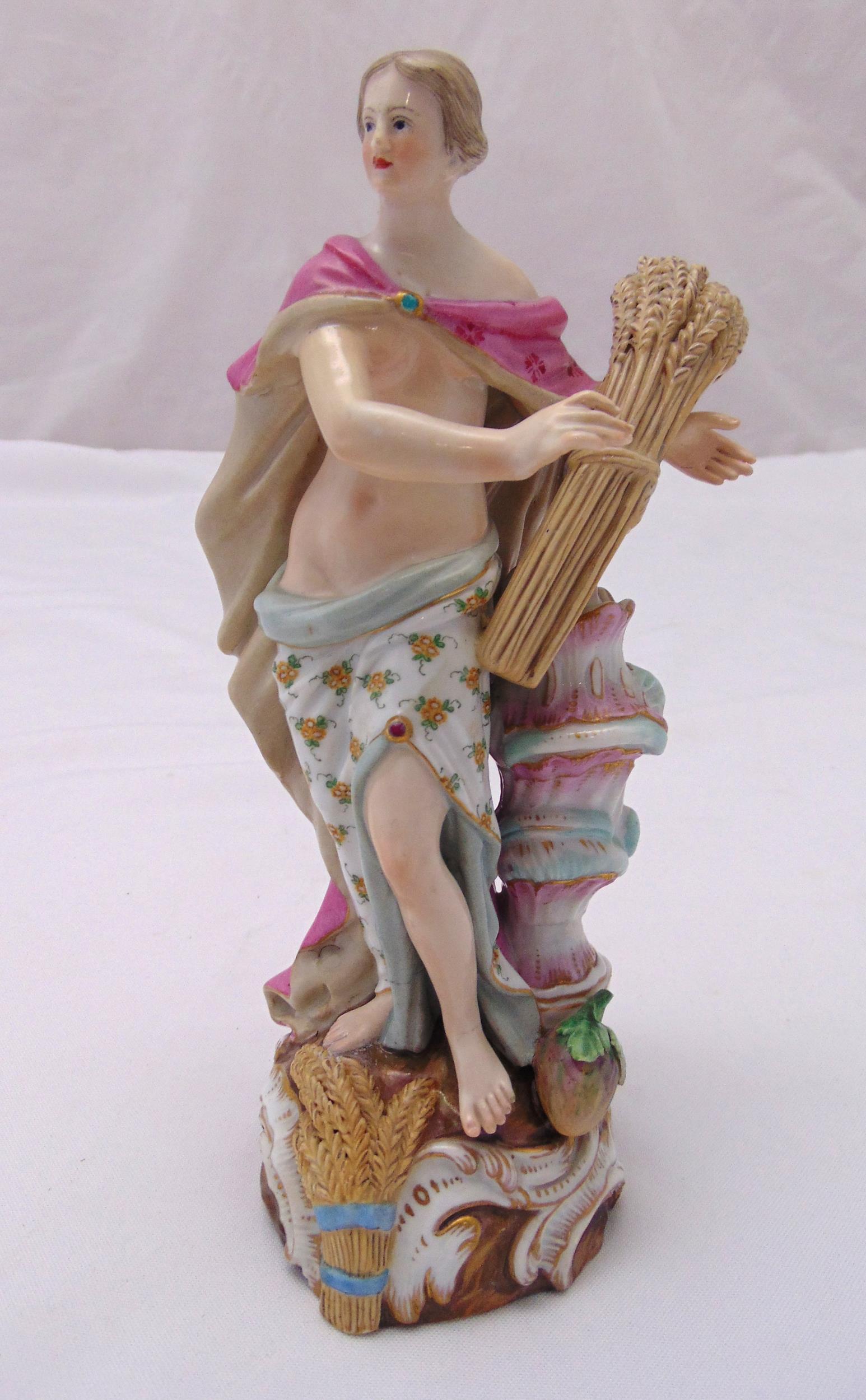 Meissen mid 19th century figurine symbolic of summer holding a sheaf of wheat on raised naturalistic