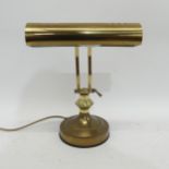 A brass students desk lamp