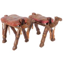 A pair of 2 small wooden camel footstools, with patterned leather cushions, H28cm