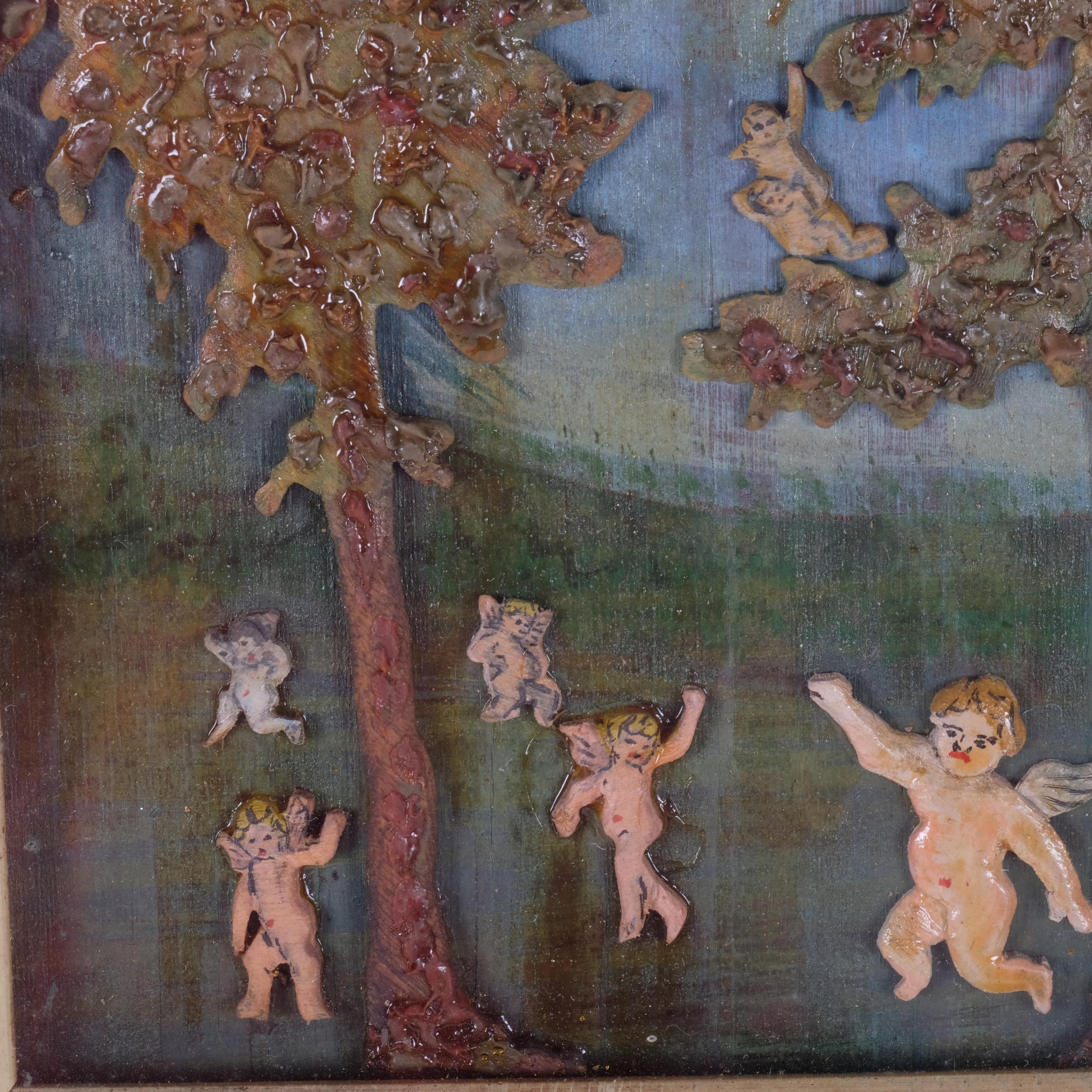 A carved and painted wood/wax relief picture, depicting trees and cherubs in glazed frame, 21cm x - Image 2 of 2