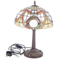 A Tiffany style table lamp on cast-metal base, with multi-coloured shade, H42cm