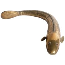 A 19th century Indian articulated brass Medina fish, with red glass eyes. L - 45cm. Nice overall,