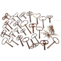 A quantity of antique steel clock keys and pocket watch keys.