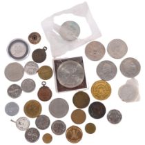 A group of various coins, including 4 x £5 coins, tokens, medallions, etc