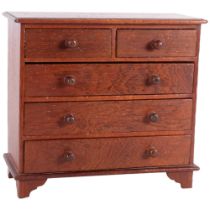 A stained wood table-top collector's chest of 2 short and 3 long drawers, W24.5cm