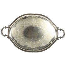 An oval silver plated on brass engraved 2-handled tea tray, width 74cm