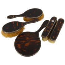 A George V silver and tortoiseshell 4-piece dressing table brush and mirror set, hallmarks for