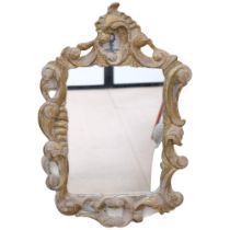 Continental carved giltwood framed wall mirror, H63cm