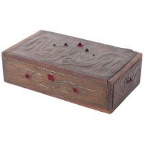 An Art Nouveau rectangular box with embossed stylised copper clad panels and red glass bosses. Hinge