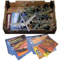 A box of diecast model aircraft on stands, etc