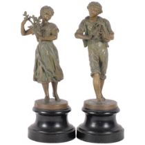 A pair of spelter figures on hardwood stands. One of a young male musician (H-31cm), the other a