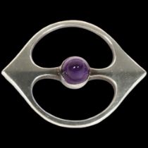 HANS HANSEN - a Danish modernist sterling silver amethyst openwork eye brooch, 46.5mm, 13.3g No