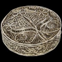An Indian silver filigree floral box, circular form, 6cm Edges are slightly bent otherwise no