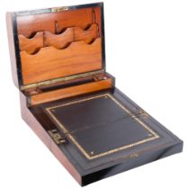 A Victorian mahogany fold-out travelling writing box, with fitted interior, two inkwells and brass