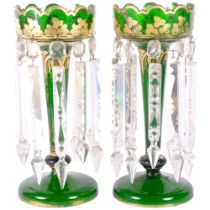 A pair of Victorian green glass and gilded table lustres, with arrowhead drops. H - 37cm. 1 lustre