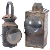 A large unmarked metal bullseye lantern. H - 32cm. And a vintage railway lantern, complete with