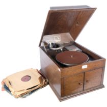 'HMV' - model 109 gramophone in oak case. With associated spare needle tins by Columbia and