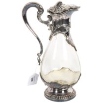 A French Claret jug, with embossed silver plated mounts and clear glass body, impressed France to