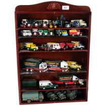 A quantity of diecast vehicles, many Eddie Stobart related in nature, in associated glass-front