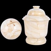 A reconstituted marble jar and cover, H29cm, and a similar ball on plastic stand