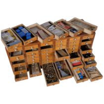 A watchmaker's multi-drawer chest, comprising 48 drawers, complete with various watch parts, winding
