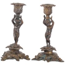 A pair of gilt-bronze candle sticks with cherub design. H - 26cm.