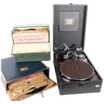 A vintage 'HMV' portable gramophone and 2 cases of 78rpm records.