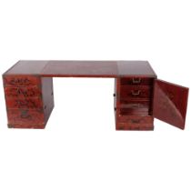 A Japanese red lacquered table top jewellery/travelling chest, converting to miniature desk, with